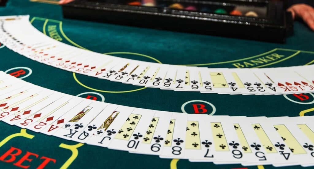 Blackjack table with cards and chips – learn blackjack rules & strategy.